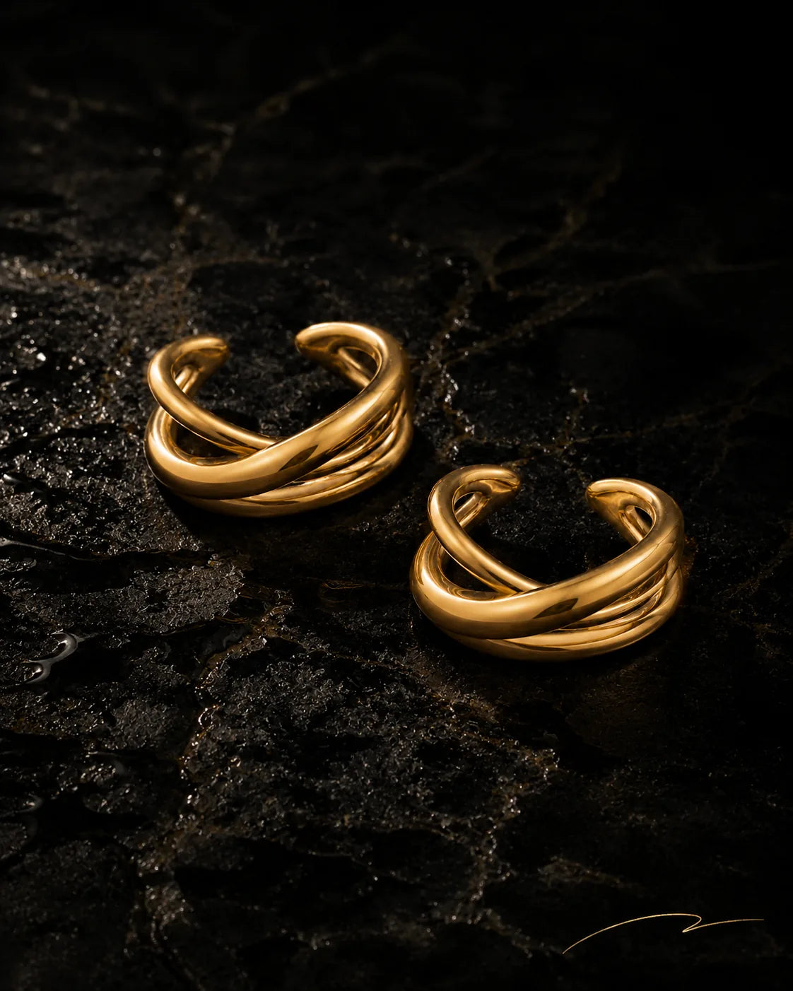 UNCLIPT Axis ear cuff pair in polished gold on wet black stone, no piercing needed