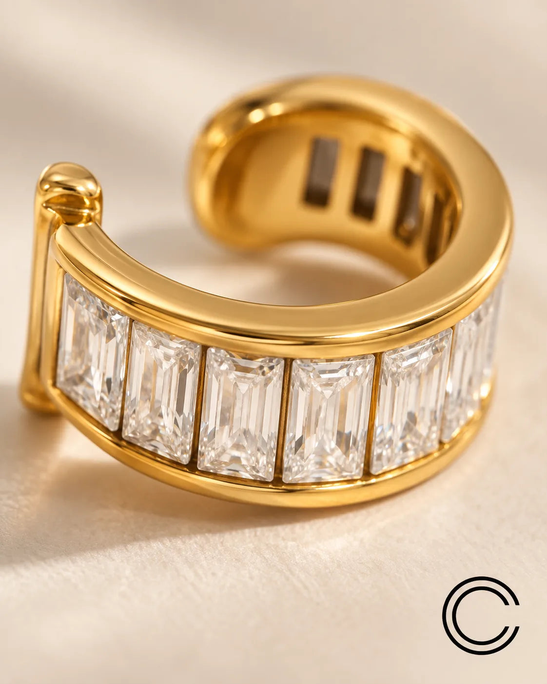 Close-up of the Gold Baguette ear cuff showing the clean line of rectangular channel-set stones