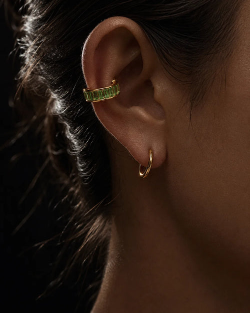 Jade Baguette ear cuff worn on the helix with a gold hoop, no piercing needed