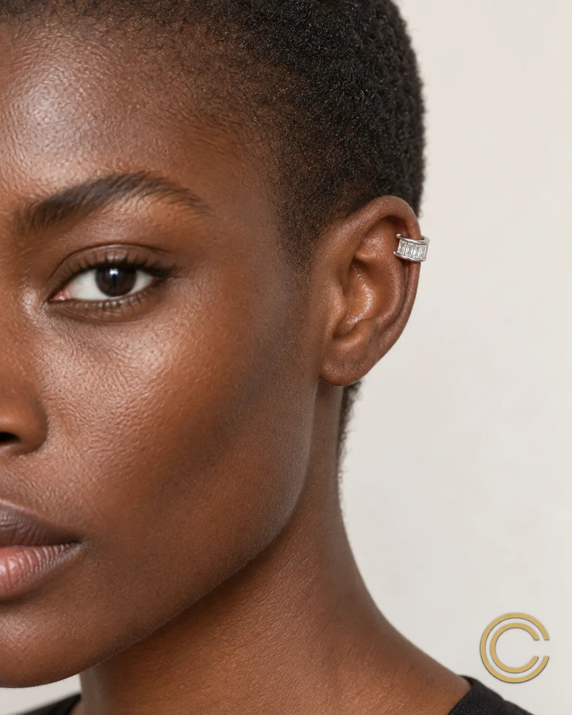 Silver Baguette ear cuff with clear baguette stones worn on the upper ear cartilage, no piercing needed