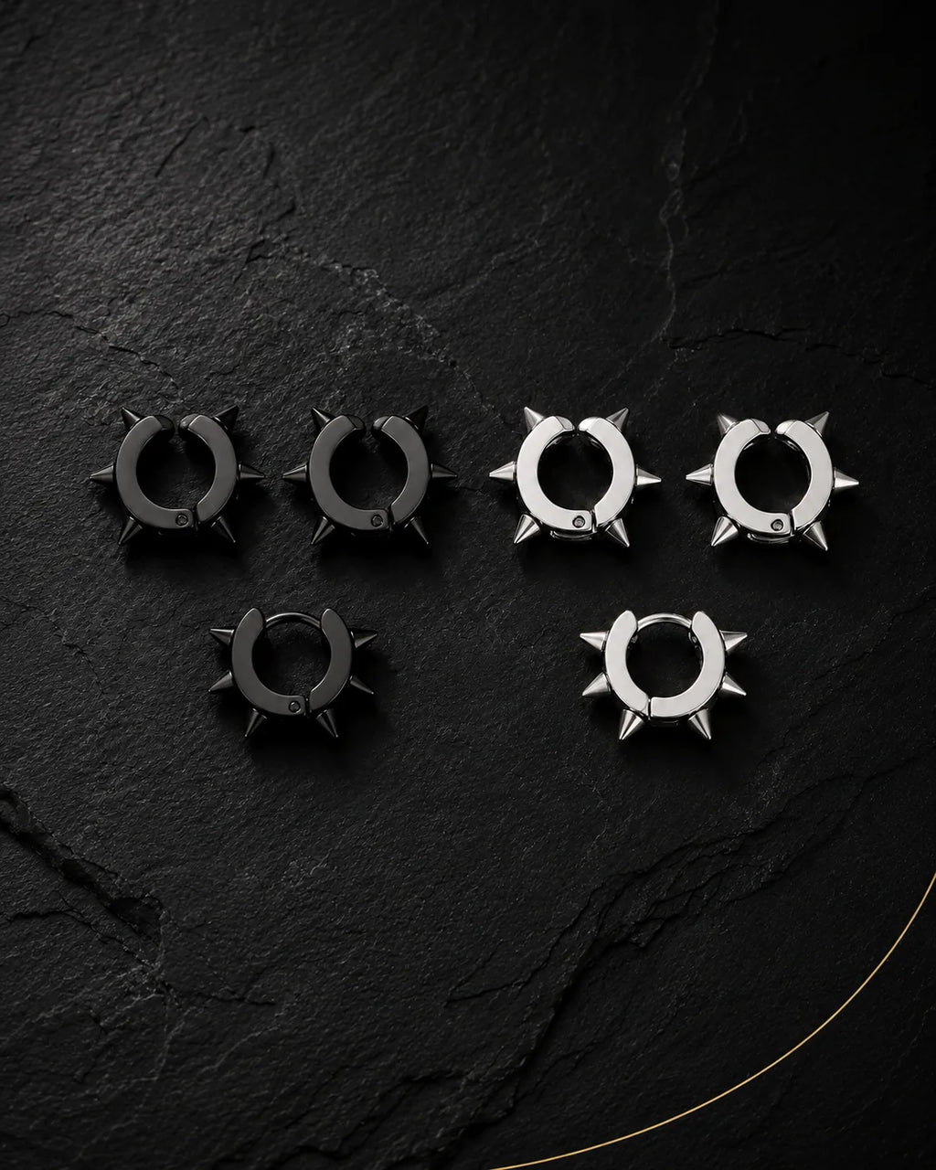 Spike ear cuff set in matte black and silver on black slate, punk style, no piercing needed
