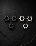 Spike ear cuff set in matte black and silver on black slate, punk style, no piercing needed
