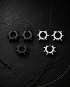 Spike ear cuff set in matte black and silver on black slate, punk style, no piercing needed