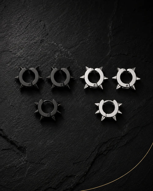 Spike ear cuff set in matte black and silver on black slate, punk style, no piercing needed